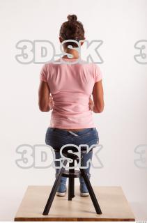 Sitting pose blue jeans pink t shirt of Oxana …